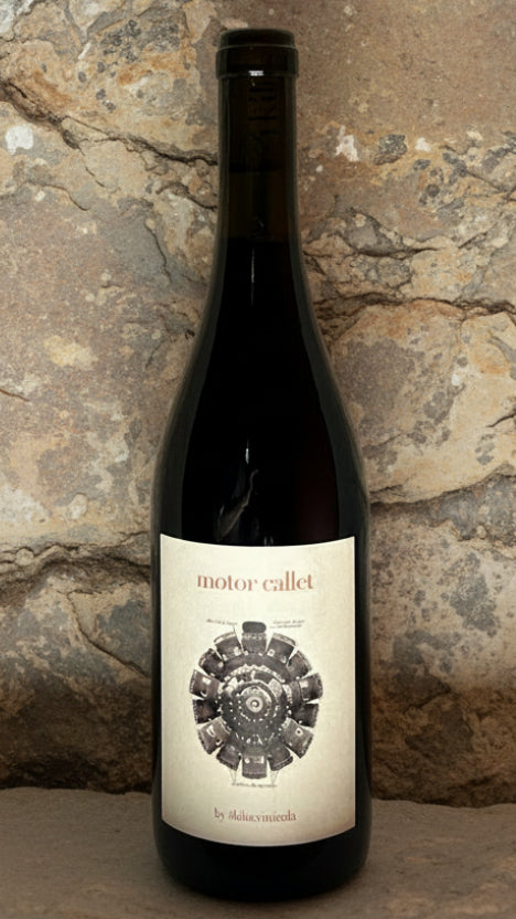 Wine bottle with a label on a textured gray background