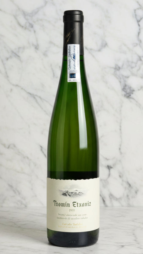 Wine bottle with a label on a marble surface